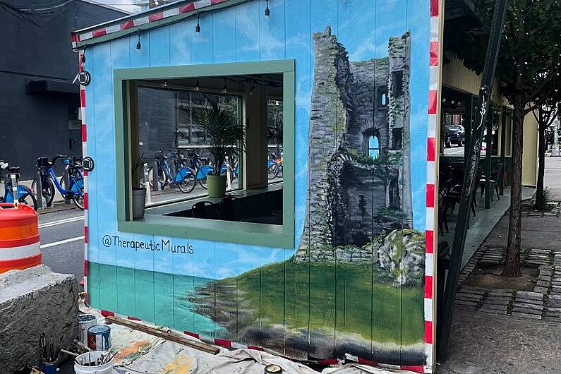 Mural of Fenit Castle being painted on Brooklyn bar
