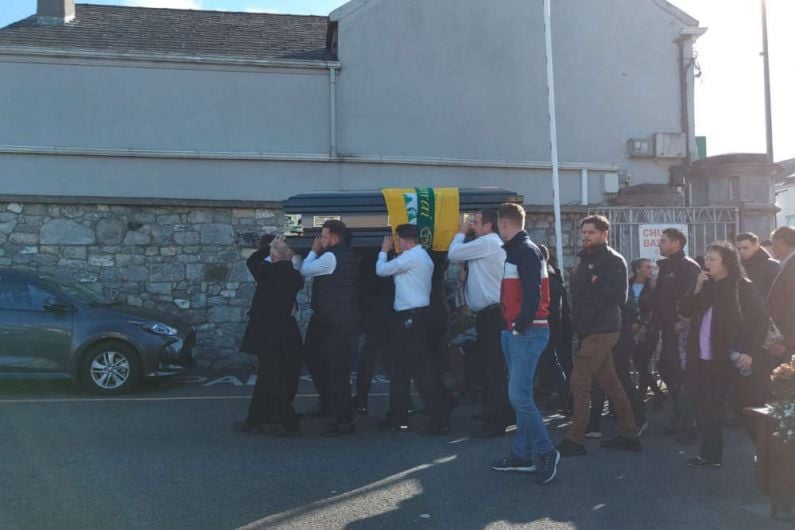 Fourth man still being questioned on Dooley murder as funeral takes place