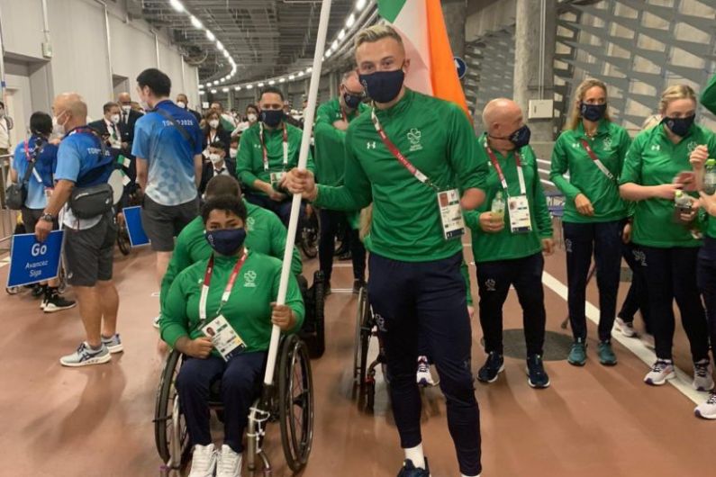 Kerry's Jordan Lee carries the flag for Irish Paralympic team
