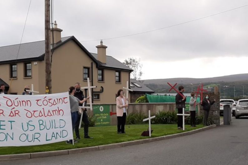 Protesters holding crosses gather outside monthly meeting of Kerry County Council