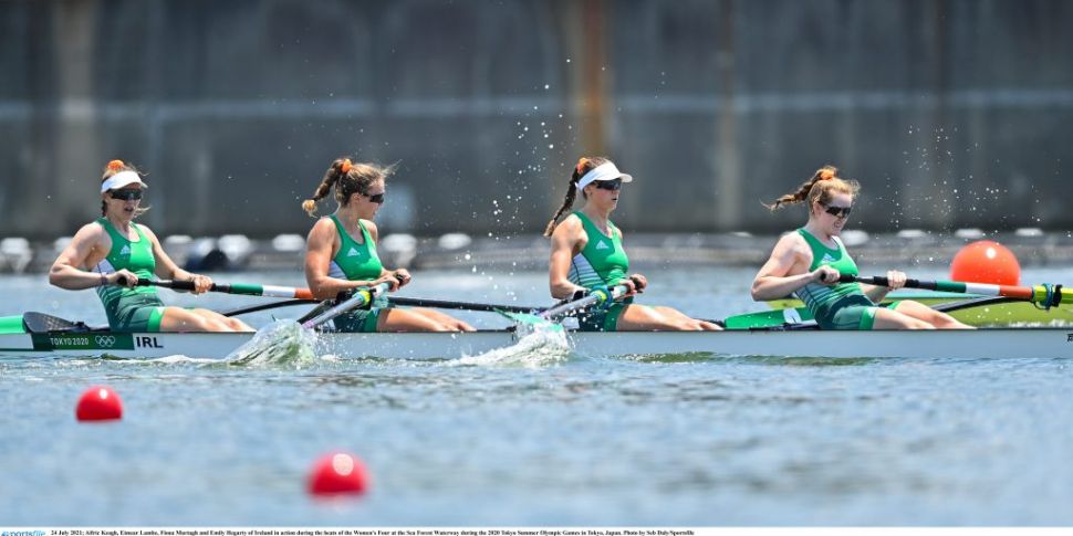 Cork's Emily Hegarty helps the...
