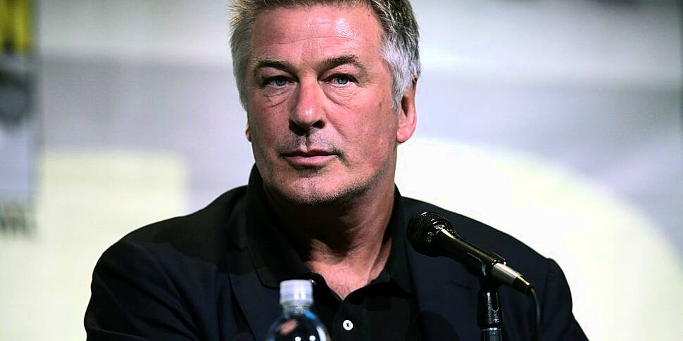 Alec Baldwin Hands Phone To Po...