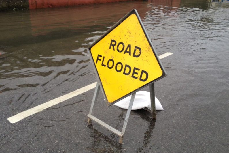 Flooding reported on local roads after heavy downpours