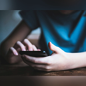 What age should a child be before they get a phone? Image