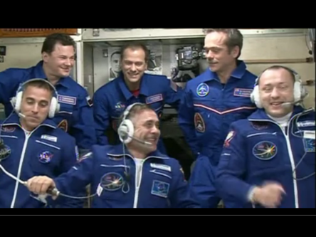 Soyuz crew arrive at space station after six-hour express flight