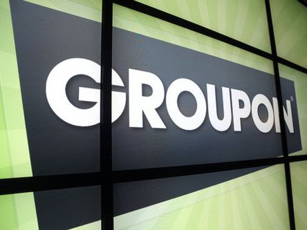 Groupon losses widen as revenues grow