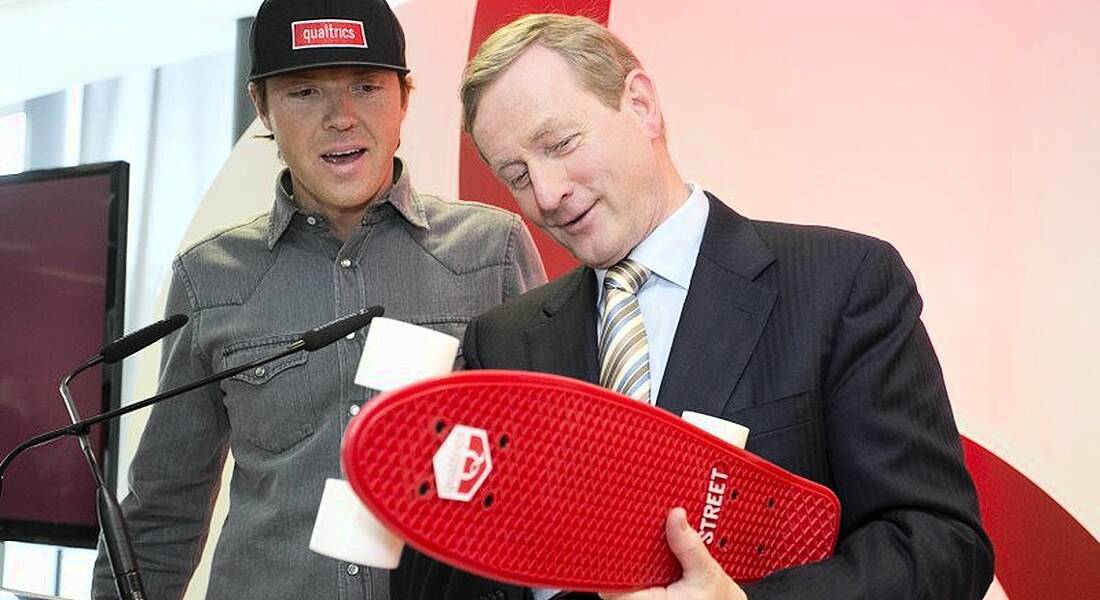 Ryan Smith CEO Qualtrics, presented Enda Kenny with a skateboard