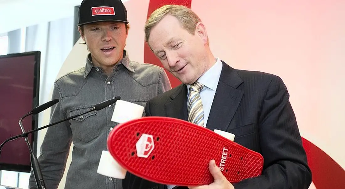 Ryan Smith CEO Qualtrics, presented Enda Kenny with a skateboard