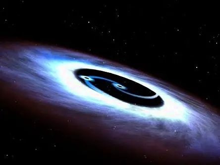 Supermassive black holes engaged in cosmic dance in nearest galactic neighbour