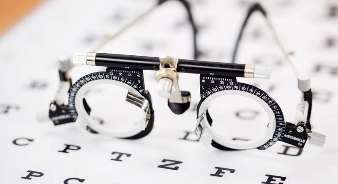Eye test glasses on eye chart