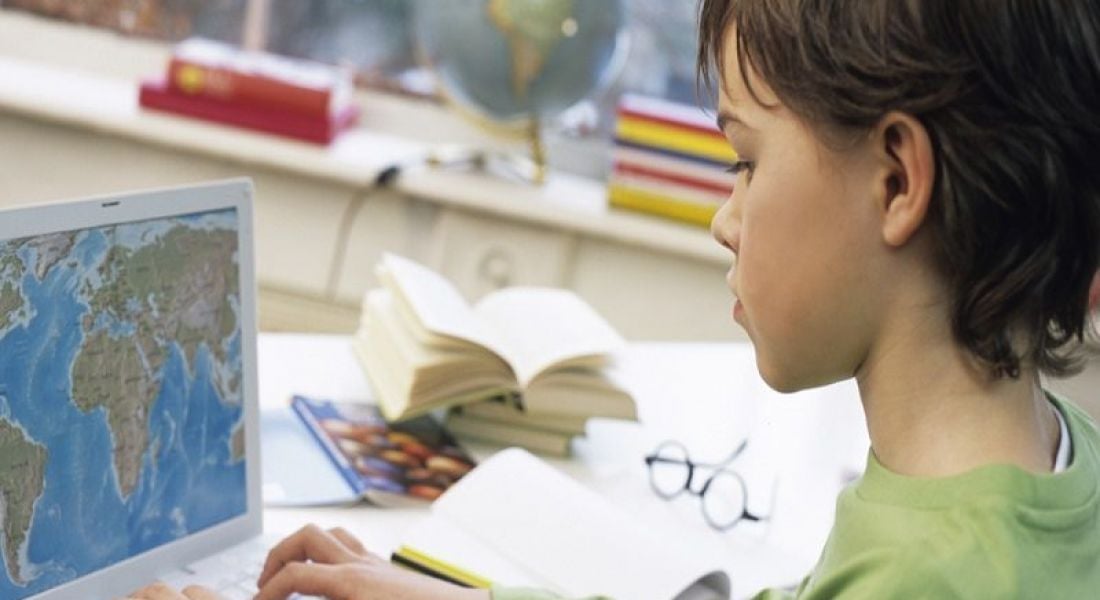 Facebook education platform: child using laptop