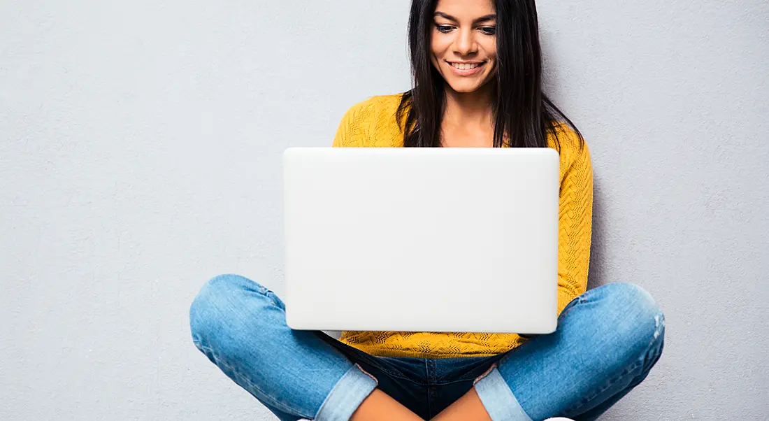 Woman coding on laptop