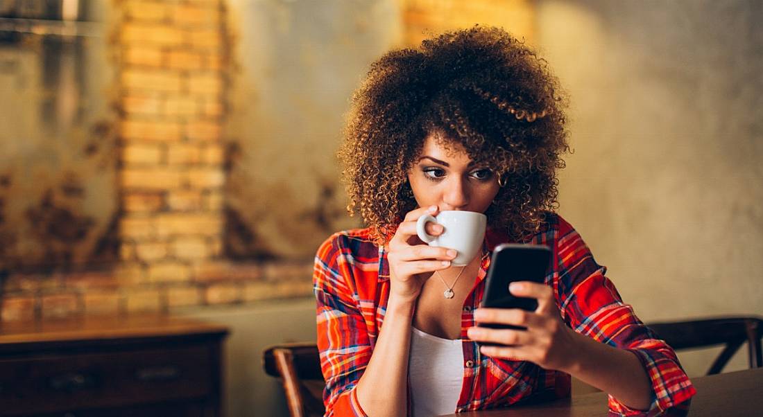 Woman using phone to find career advice