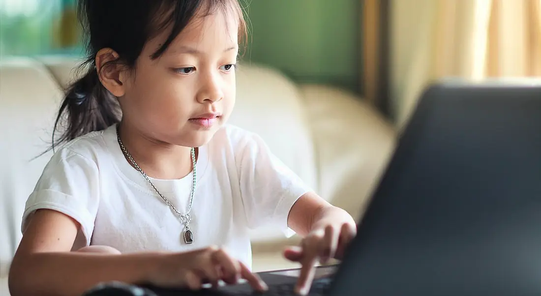 Talent gap: Young girl using computer