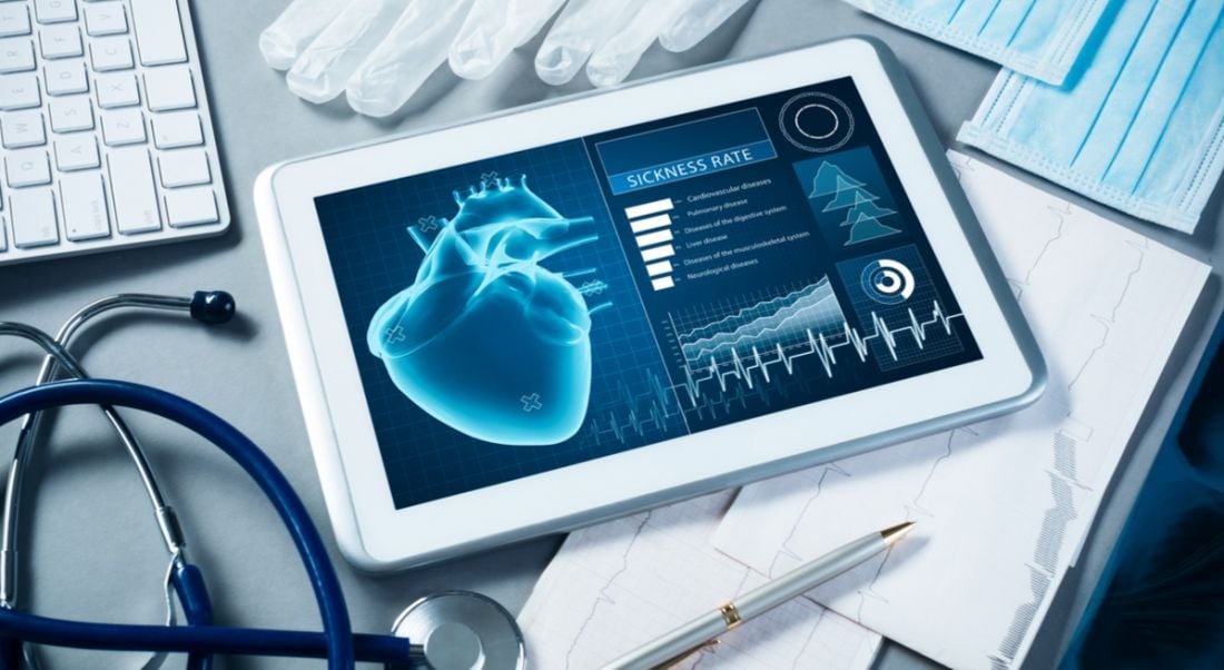 A table with an array of medical devices and computer devices to depict the medtech sector.