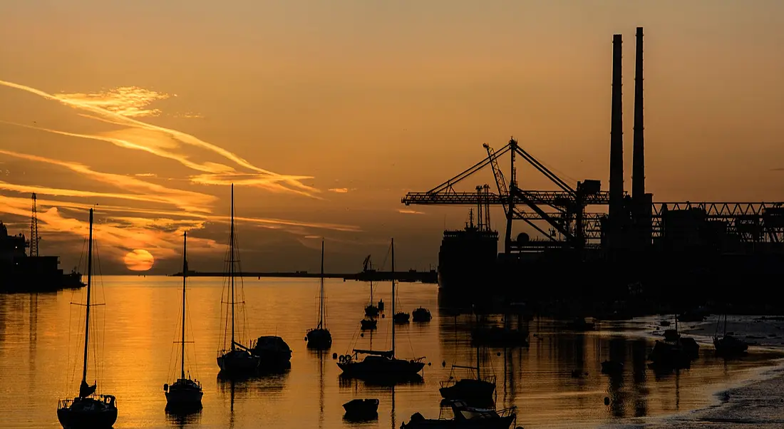 Sunrise at Dublin Port. Image: Paul Daly/Shutterstock.com EY report on economic growth in ROI and NI