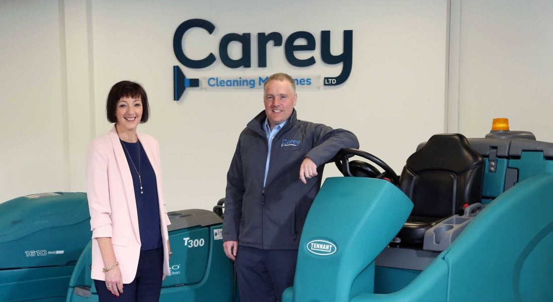 From left: Moira Loughran, eastern and north eastern regional manager at Invest NI; William Carey director at Carey Cleaning Machines. Image: Invest NI. NI manufacturing firm jobs.