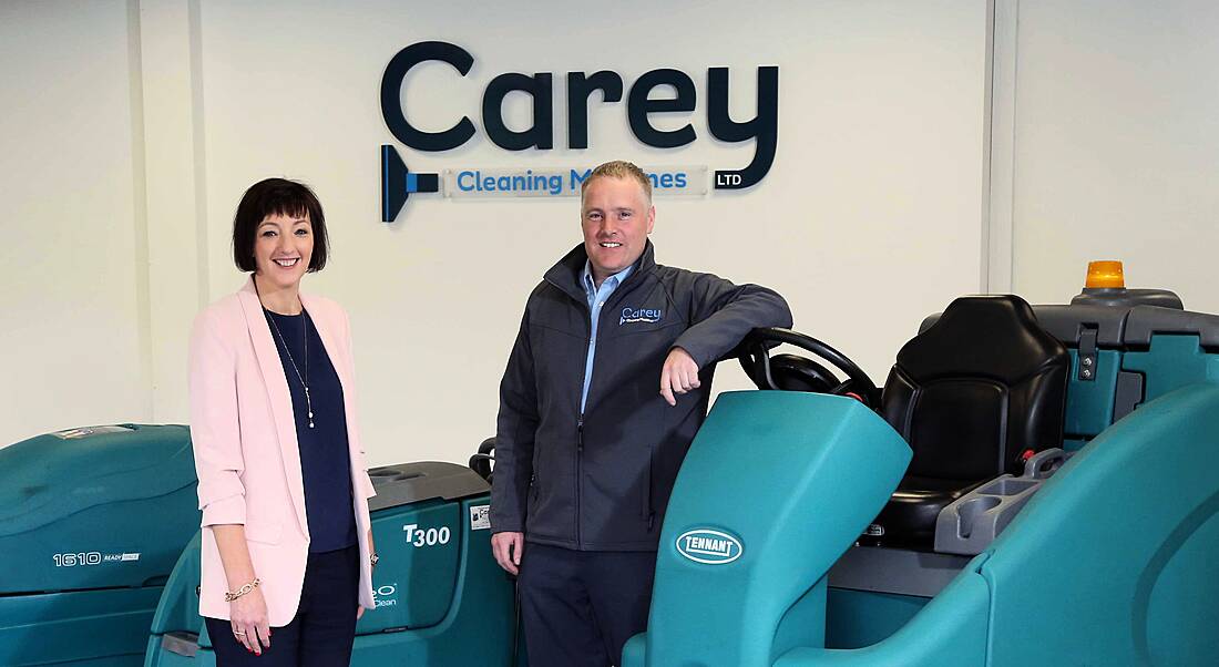 From left: Moira Loughran, eastern and north eastern regional manager at Invest NI; William Carey director at Carey Cleaning Machines. Image: Invest NI. NI manufacturing firm jobs.