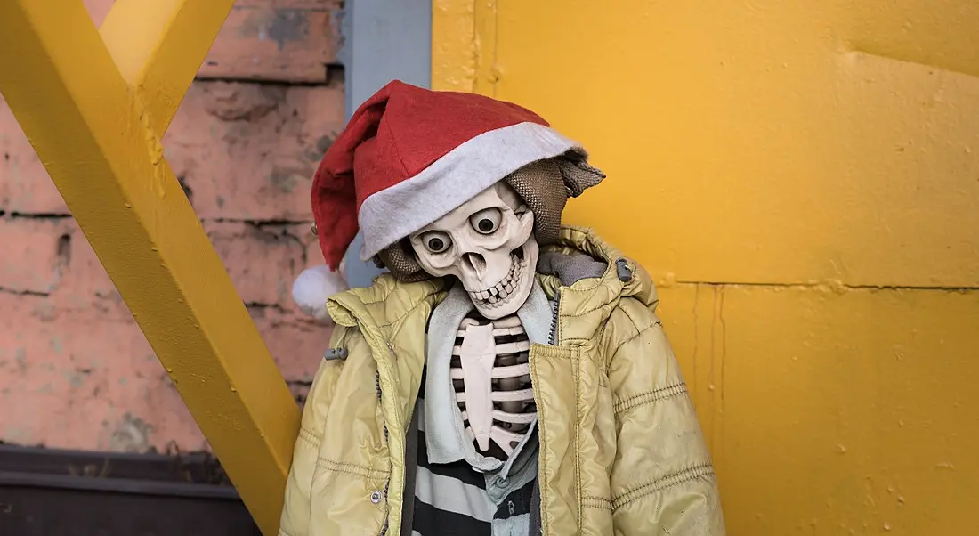 A skeleton in a yellow puffa jacket and Santa had propped against a wall.