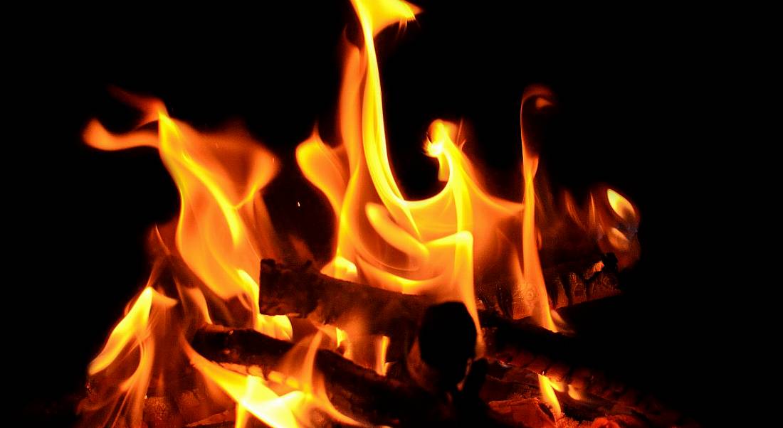 A close-up of a campfire against a black background representing the hottest tech jobs.