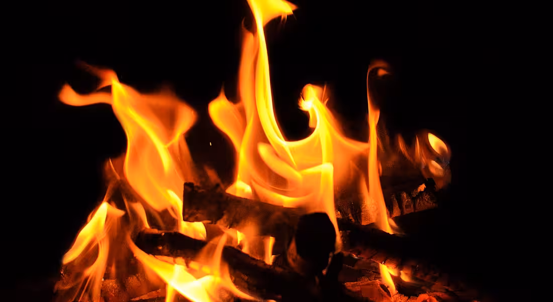 A close-up of a campfire against a black background representing the hottest tech jobs.