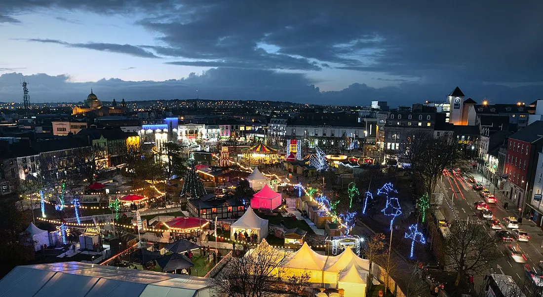 Panoramic view of Galway Continental Christmas Market at night.