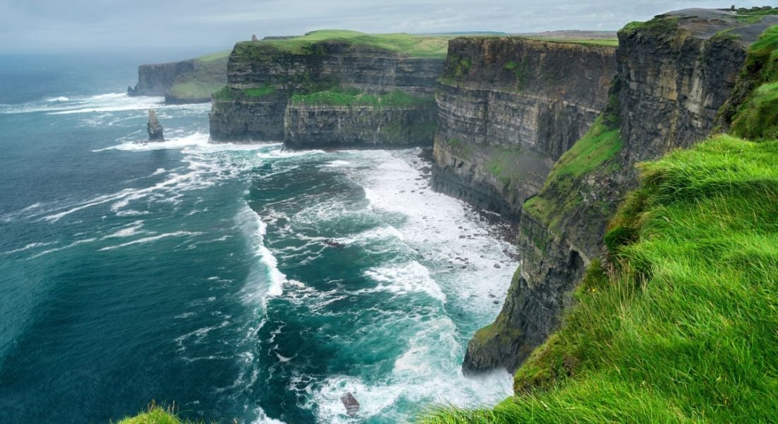 View of Cliffs of Moher and wild Atlantic Ocean, which awaits anyone relocating to Ireland.