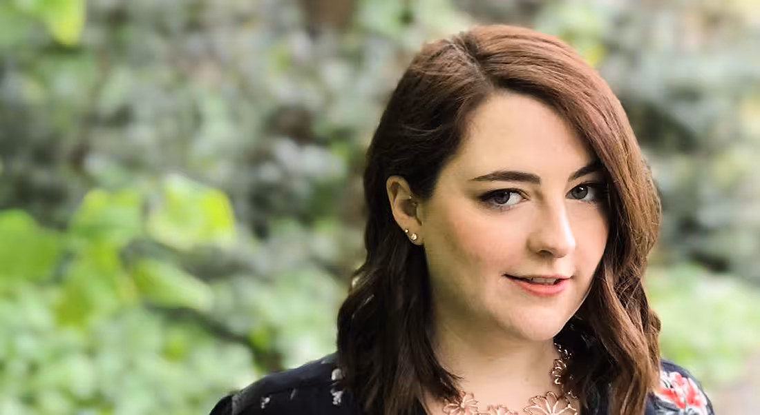 A close-up headshot of a young woman with brown hair. In this article, she discusses her career change.