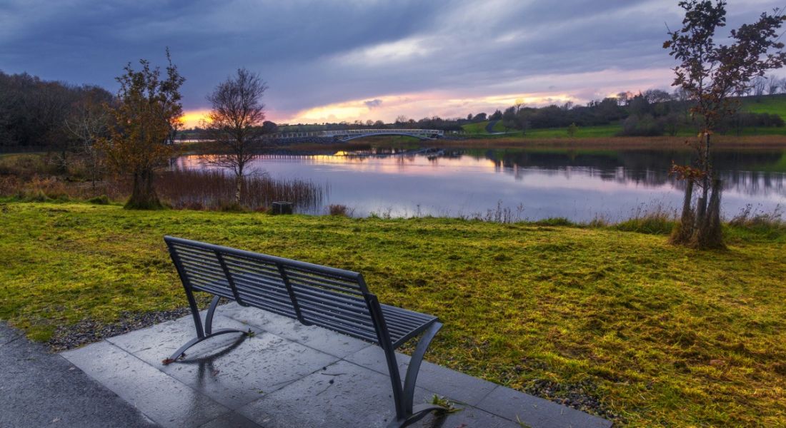 Photo of a bench facing a sunrise at Lough Lannagh, Castlebar, Co Mayo.