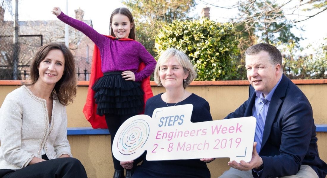 Two women and a man beside a little girl doing a superhero pose to mark launch of Intel and Engineers Ireland STEM skills initiative.
