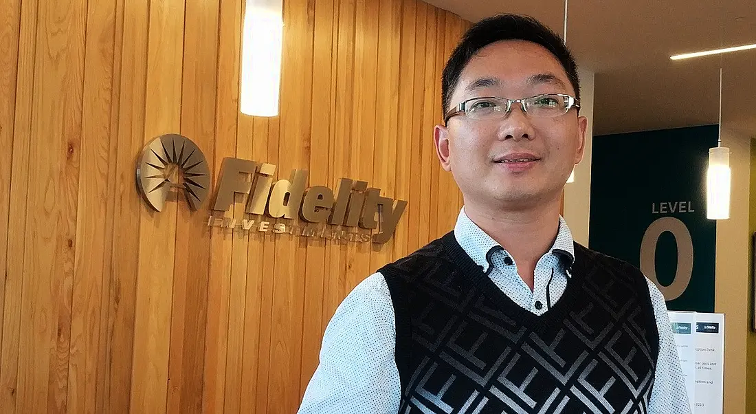 Headshot of a man looking into the camera in the reception of Fidelity Investments.