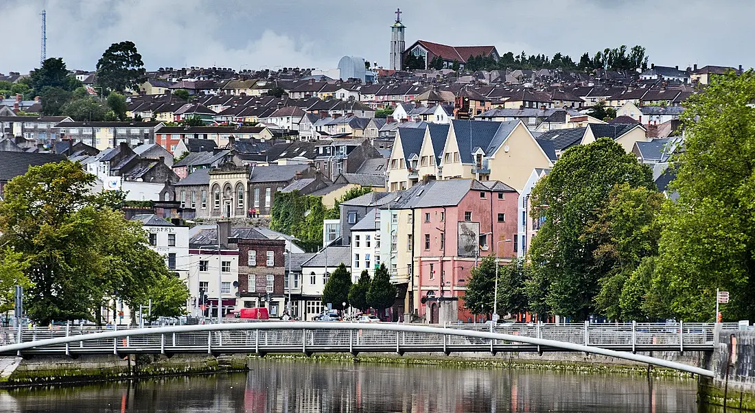 Cork cityscape with colourful buildings and a bridge across the river.