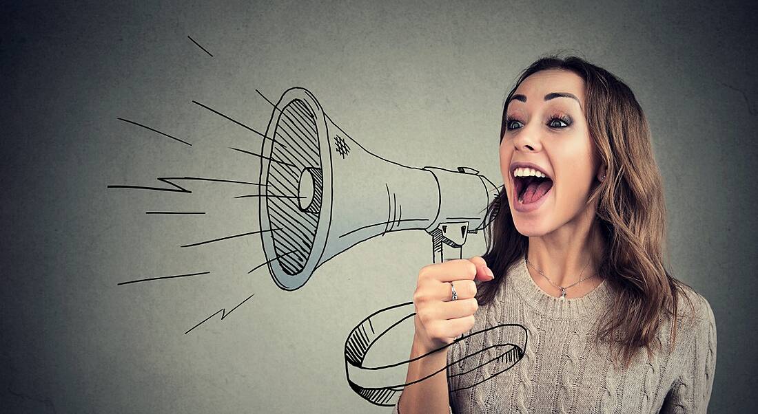 Girl cheerfully shouting into a megaphone that is animated against a grey background.