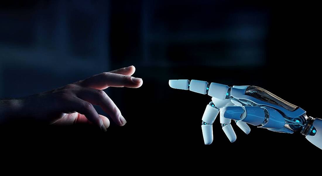 White cyborg finger about to touch human finger, against a dark background.