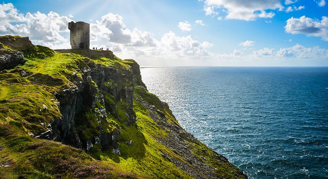 Sun shining on the Cliffs of Moher in Clare, Ireland.