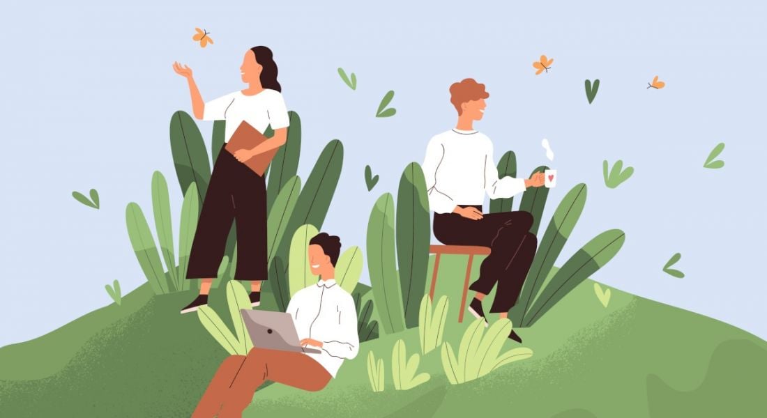 Cartoon image showing three employees enjoying a healthy workplace culture. They are sitting on a hill of grass on their laptops with cups of tea.