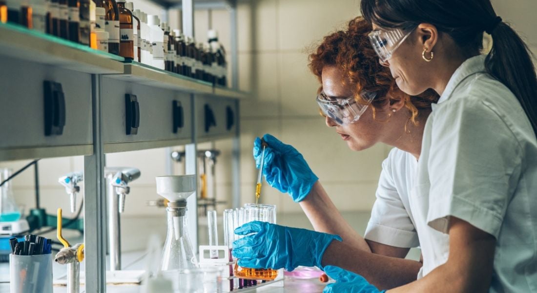 Two biopharma scientists working in a lab.