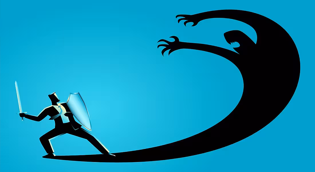 A man battles his fears, representing his internalised fear of workplace error.