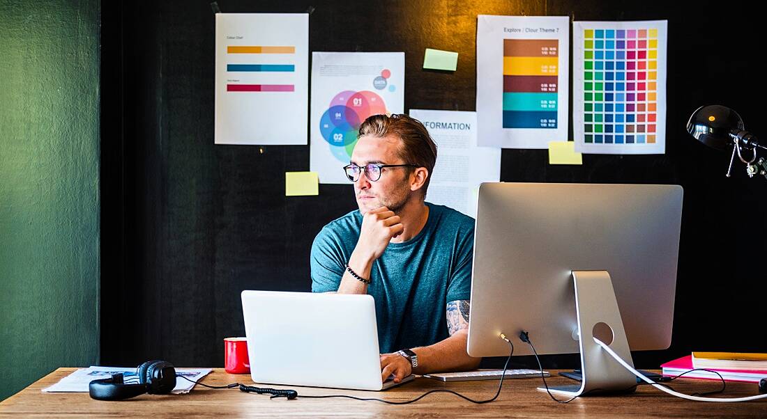 A man stares into the distance, representing a sense of a decline in workplace productivity.