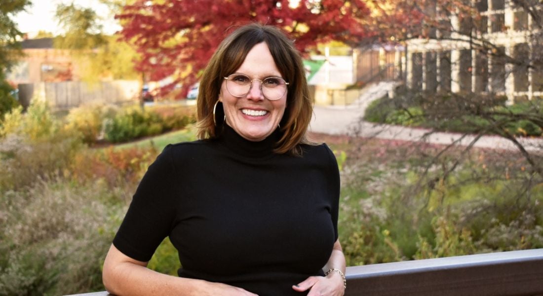 Cyber expert Lynn Dohm of WiCyS poses for the camera, outside.