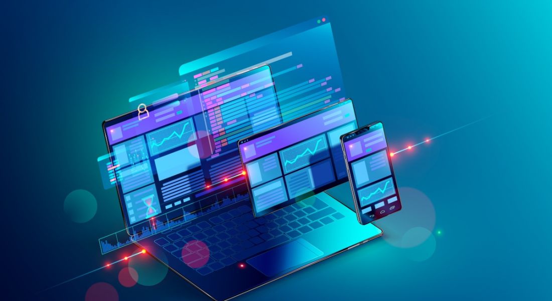 Front-end and back-end web development concept with a computer and mobile and tablet with websites open on them. They are illuminated in blue light floating on a blue background.