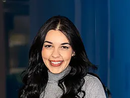 A headshot of a woman smiling at the camera. She is Maria Butler from Intel.