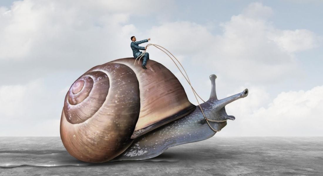 An illustration of a worker sitting atop a giant snail holding reins as if hurrying the snail along. The worker has no patience.