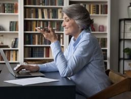 Two women are speaking to each other over a video call during a remote job interview.