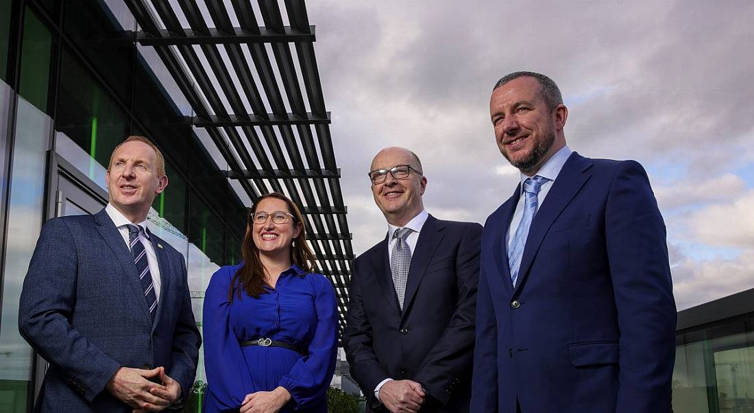 From left: Michael Lohan, CEO, IDA Ireland; Minister of State Emer Higgins, TD; Tom Clarke, West; and Simon Frainey, West, all posing outside a building with a grey sky in the background.