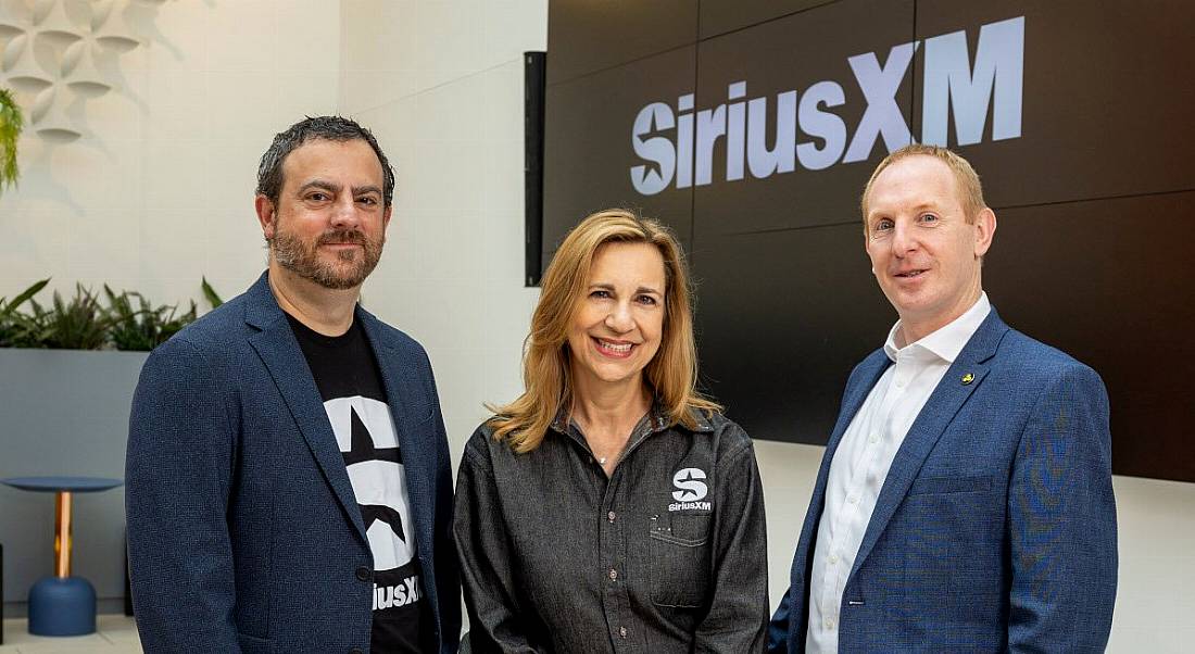 Members of SiriusXM and IDA Ireland pose at SiriusXM headquarters.