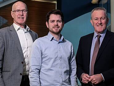 Three men smile for a photograph. They are celebrating the news of Ctrl Alt’s latest investment.