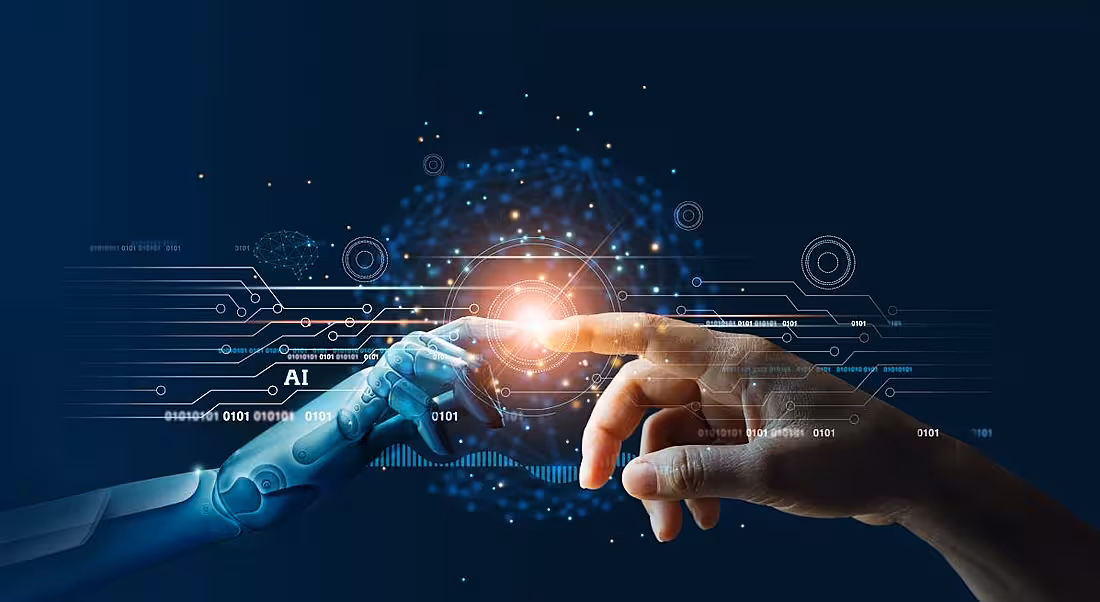 An AI hand reaching out to touch a human hand, showing the amalgamation of worlds.