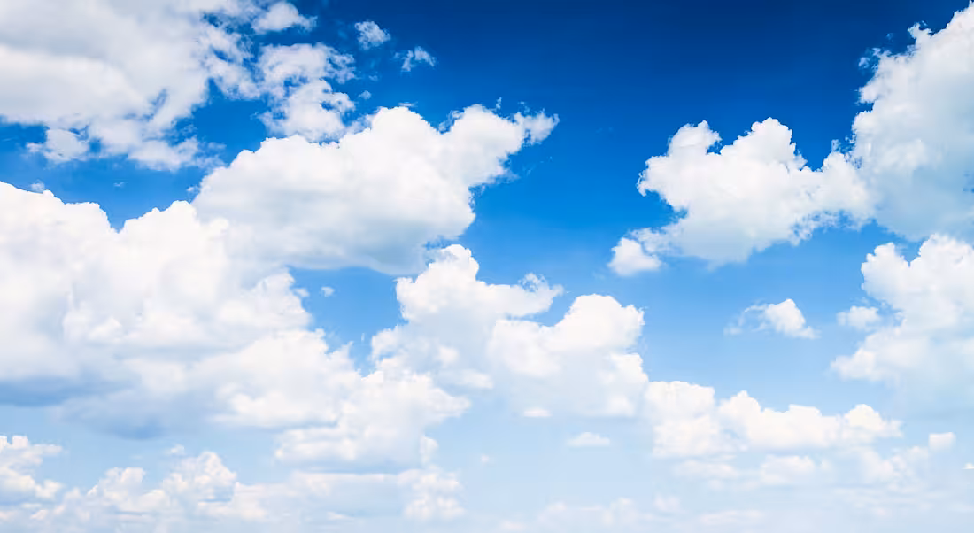 Clouds against a blue sky, representing cloud computing and skills.