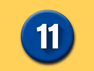A white number eleven on a round blue button on top of a yellow background.